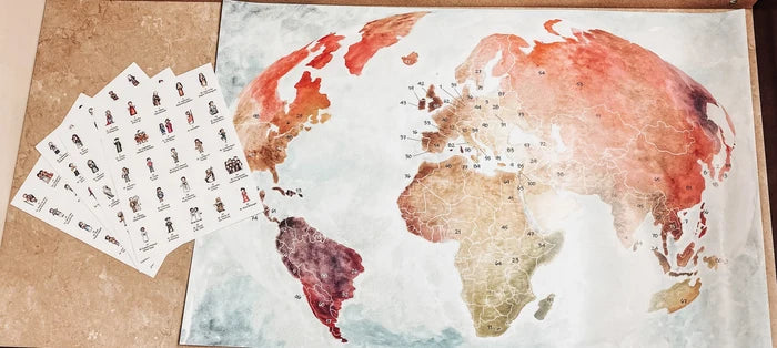 World map poster with a set of stamps on a cardboard surface