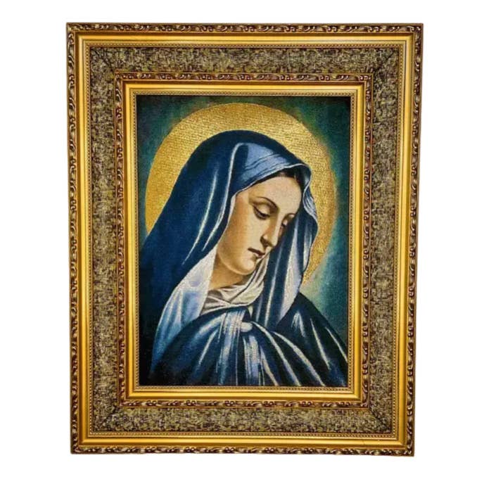 Framed artwork of a religious figure with a gold and blue color scheme.