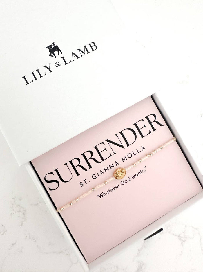 Lily & Lamb jewelry box with 'Surrender' bracelet on a white background