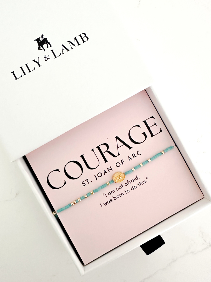 Bracelet with inspirational quote on a pink card by Lily & Lamb