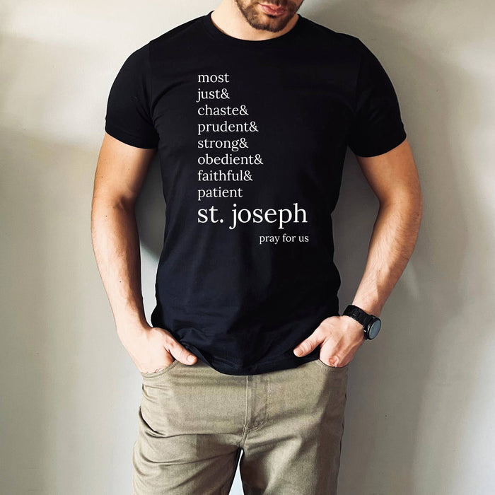 Man wearing shirt that says, “most just & chaste & prudent & strong & obedient & faithful & patient- st. Joseph pray for us”