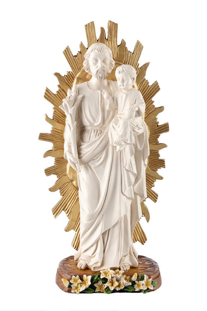 Statue of a religious figure holding a child with a gold halo on a white background