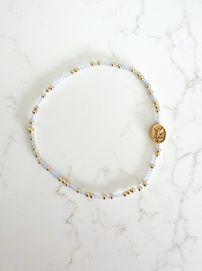 Bracelet with small beads on a marble surface
