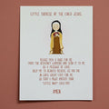 Print with an illustration of a St. Therese and text on a white surface