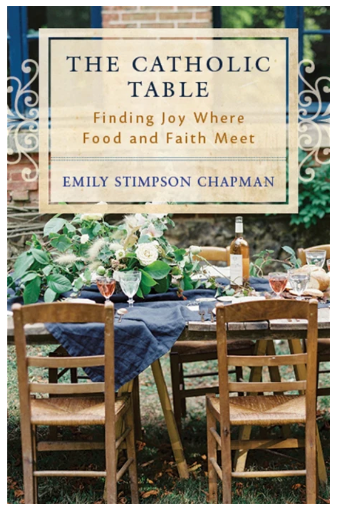 Book cover of 'The Catholic Table' by Emily Stimpson Chapman with a table setting outdoors.