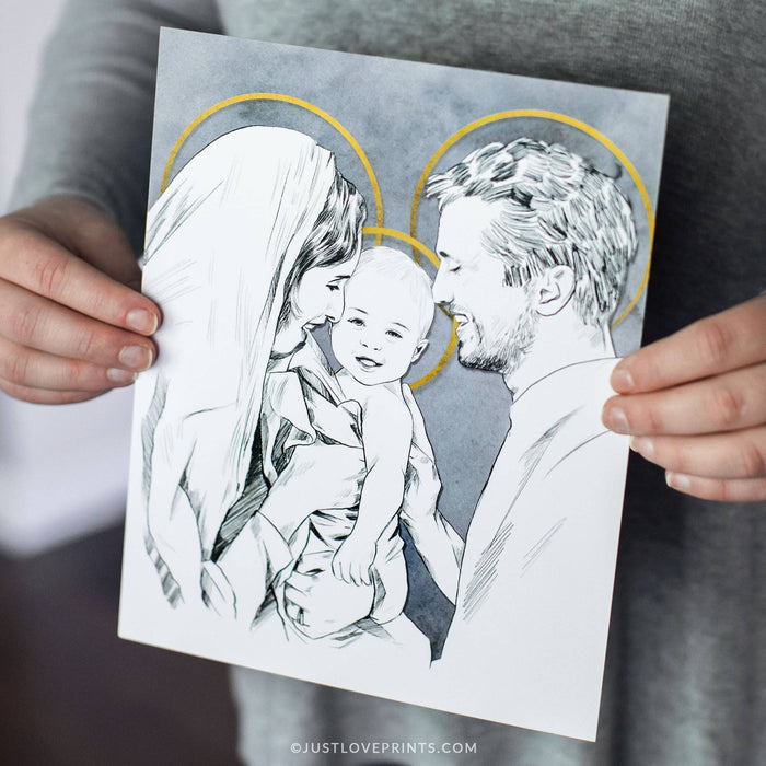 Person holding a print of a black and white illustration of a family on a gray background.