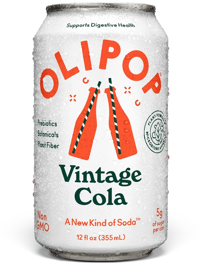Aluminum can of OLIPOP Vintage Cola soda with condensation, featuring red and green text on white background, 12 fl oz.