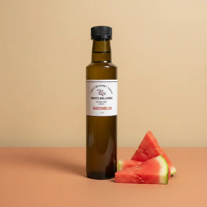 Watermelon White Balsamic Vinegar 250ml bottle on warm terracotta surface