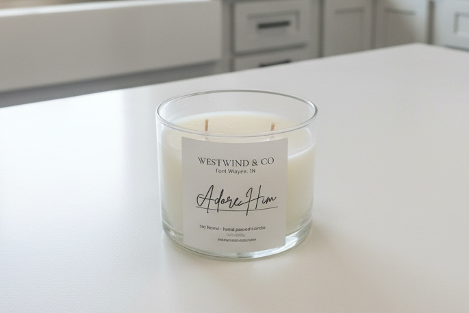 Candle with a label on a white surface